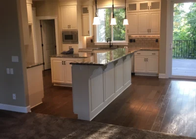Kitchen island with pendant lights and recessed can lights