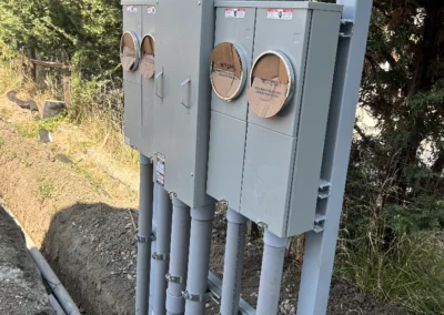 Meter bases mounted on a post with conduit drops