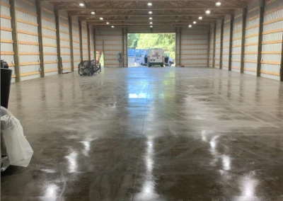 Pole barn interior lit by rows of LED high-bay fixtures
