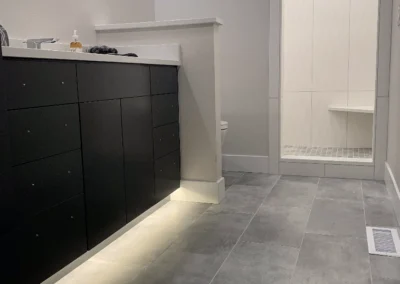 Under-cabinet LED strip lighting glowing along a dark island